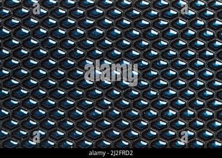 Eine Textur aus einem blauen Kunststofftuch mit Blasen in der Nahaufnahme Stockfoto