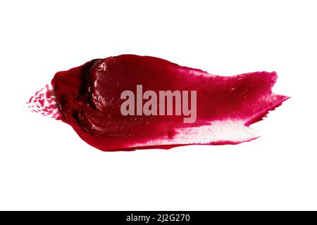 Abstrakter roter Abstrich von mattem Lippenstift, isoliert auf weißem Hintergrund. Stockfoto