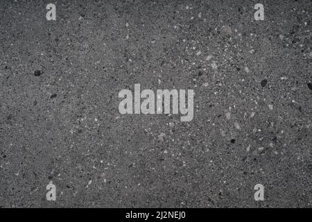 Schwarz grau Kies Stein Terrazzo Wand Hintergrund Stockfoto