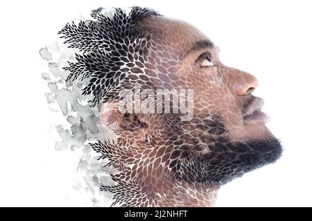 Paintographie. Ein Porträt eines afrikanischen Mannes kombiniert mit einem abstrakten Gemälde Stockfoto