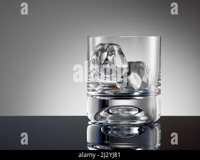 Empty whiskey glass with ice cubes ready to be filled. Hard drink concept. Stockfoto