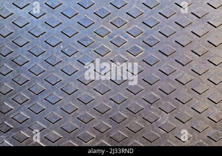 Metallische Oberfläche, Schachtabdeckung Stockfoto