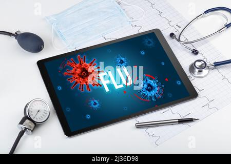 Tablet-pc und Arztgeräte auf weißer Oberfläche Stockfoto