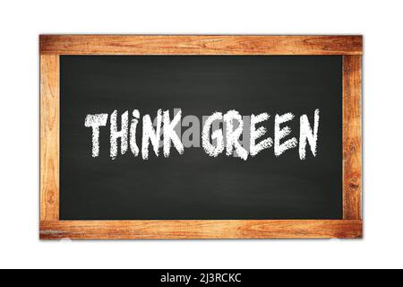 DENKEN SIE GRÜNEN Text auf schwarzen Holzrahmen Schule Tafel geschrieben. Stockfoto