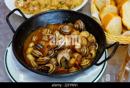 Escargots. Spanische Küche Stockfoto