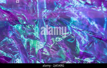 Farbenfroher Grunge-Hintergrund. Raue Textur. Neon hell rot grün blau glänzend faltig Rock dunkel abstrakt Kunst. Hochwertige Foto Stockfoto