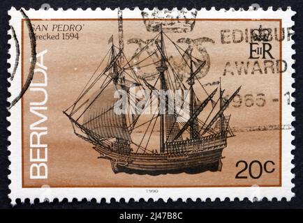 BERMUDA - UM 1986: Eine auf Bermuda gedruckte Marke zeigt San Pedro, Schiffswrack, zerstört 1594, um 1986 Stockfoto