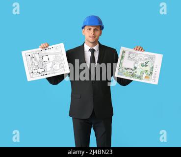 Junger männlicher Landschaftsdesigner mit neuen Projekten auf farbigem Hintergrund Stockfoto