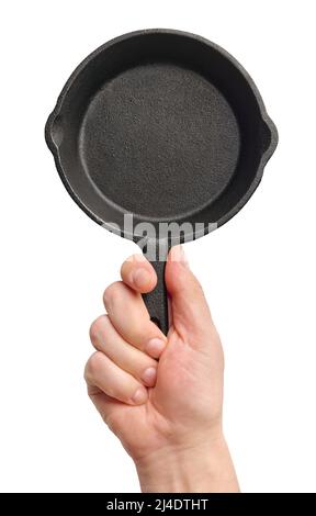 Schwarze gusseiserne Bratpfanne mit Handgriff, isoliert auf weißem Hintergrund Stockfoto