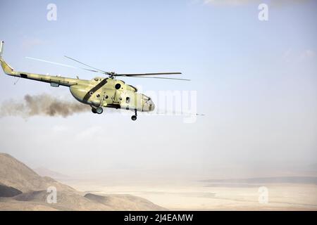 Der Pilot der afghanischen Nationalen Luftwaffe, Oberstleutn Mohammad Arif, feuert eine 57mm-Rakete von einem MI-17-Hubschrauber auf der Texas High-Low Range, in der Nähe von Kandahar, Afghanistan, ab, 23. Februar 2011. Die Mil Mi-17 (NATO-Berichtsname: Hip) ist eine 1975 eingeführte sowjetisch konstruierte russische Militärhubschrauberfamilie (Mi-8M), die ab 2021 in zwei Fabriken in Kasan und Ulan-Ude produziert wird. Im russischen Dienst ist sie als Mi-8M-Serie bekannt. Stockfoto