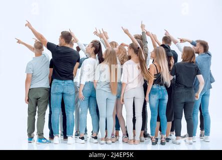 Rückansicht.eine Gruppe von jungen Gleichgesinnten zeigt nach vorne. Stockfoto