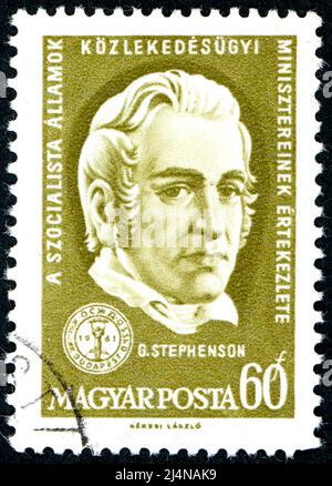 In Ungarn gedruckte Briefmarke, zeigt Porträt eines englischen Bauingenieurs und Maschinenbauingenieurs George Stephenson, um 1961 Stockfoto