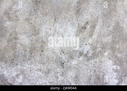 Abstrakter Hintergrund mit grauer natürlicher Betonwandstruktur. Grau gewaschene Zementoberfläche. Stockfoto