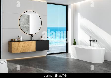 Innenraum des komfortablen Badezimmer mit weißen Wänden, Betonboden, gemütliches schwarzes Waschbecken mit Schrank, ovaler Spiegel an der Wand, Badewanne. 3D Rendern Stockfoto