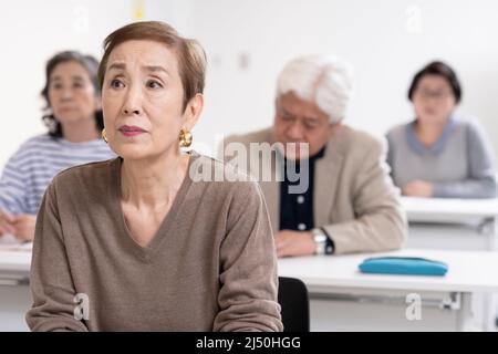 Senior am Seminar Stockfoto