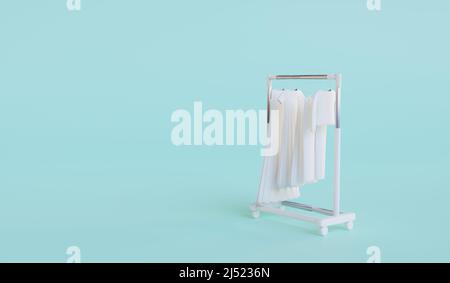 Rolling Kleiderbügel Rack mit Kleidung auf Minze Hintergrund. E-Commerce- oder Online-Shopping-Konzept. 3D Rendern Stockfoto