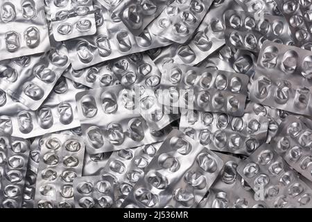 Gebrauchte leere Pille Blister-Packs, Silber Medizin-Pakete Hintergrund, Behandlung und Medikamente Konzept Stockfoto