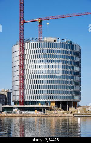 Bau des kreisförmigen Bürogebäudes „Spidsen“ in Nordø/Redmolen, Kopenhagen, Dänemark Stockfoto