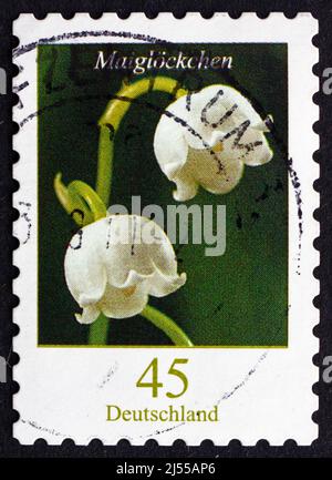 DEUTSCHLAND - UM 2011: Eine in Deutschland gedruckte Marke zeigt Maiglöckchen, Convallaria majalis, Blumenpflanze, um 2011 Stockfoto