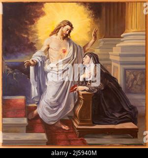 BARI, ITALIEN - 3. MÄRZ 2022: Das Gemälde der Erscheinung des Herzens Jesu an die heilige Theresa von Avila in der Kirche Chiesa di Sacro Cuore aus dem 20. Jh. Stockfoto