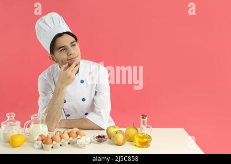 Berufskonzept, junger attraktiver männlicher Koch Stockfoto