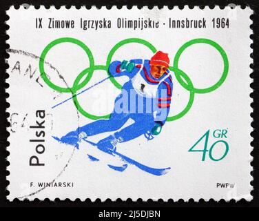 POLEN - UM 1964: Eine in Polen gedruckte Marke zeigt Skifahren, Olympische Winterspiele 9., Innsbruck, um 1964 Stockfoto