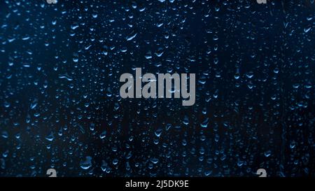 Wassertropfen auf schwarzem Hintergrund abstrakte Textur Hintergrund Stockfoto