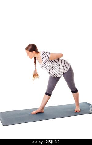 Schwanger Frau tun Yoga asana parsvottanasana Stockfoto