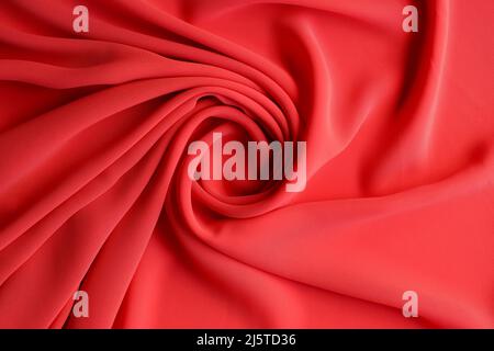 Abstrakter Hintergrund Luxus-Stoff in roter Farbe und welligen Falten Stockfoto