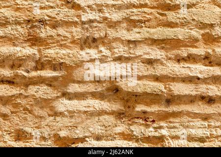 Alte Mauer aus lehmziegel. Mediterraner mittelalterlicher Stil. Nahtlose Mustertextur Stockfoto