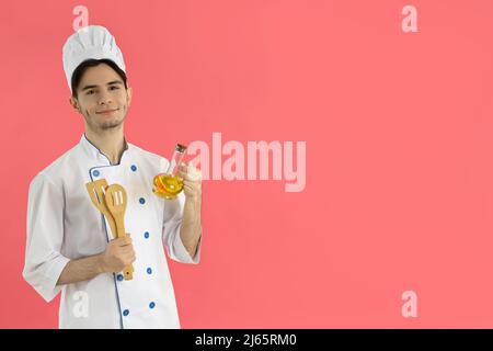 Berufskonzept, junger attraktiver männlicher Koch Stockfoto