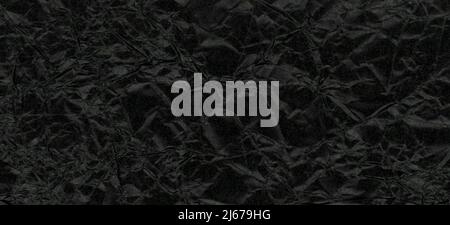 Schwarze zerknitterte Papiertextur als Hintergrund nützlich Stockfoto