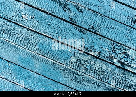Alte grüne Holzwand mit rissiger Farbe, Hintergrundstruktur. Hochwertige Fotos Stockfoto