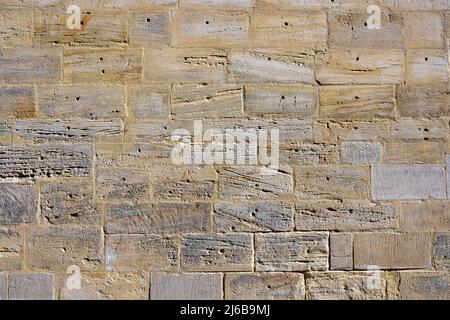 Hintergrund einer alten Mauer aus Naturstein Stockfoto