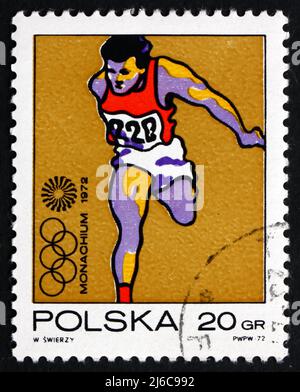 POLEN - UM 1972: Eine in Polen gedruckte Briefmarke zeigt Olympic Runner, Olympische Spiele 20., München, um 1972 Stockfoto