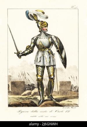 Ritter in Rüstung, Hof von König Karl VII von Frankreich, 15. Jahrhundert. In geplumptem Helm mit Visier, Kettenpost-Hauberk, voller Panzerung mit Goldbesatz, mit Schwert und Schild. Im Kampf. Seigneur de la Cour de Charles VII. Revetu de son Armure. Handkolorierte Lithographie von Lorenzo Bianchi nach Hippolyte Lecomte aus Costumi civili e militari della monarchia francese dal 1200 al 1820, Neapel, 1825. Italienische Ausgabe von Lecomtes zivilen und militärischen Kostümen der französischen Monarchie von 1200 bis 1820. Stockfoto