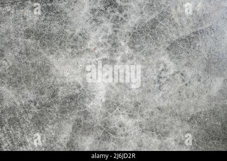 Hintergrund Texturen Beton grau dunklen Risse und Flecken mit Flecken. Alt schäbig, aber teuer stilvoll und solide. Stockfoto