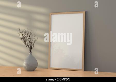 Vertikaler Holzrahmen auf Holzregal oder Schreibtisch und graue Wand. 3D Rendern Stockfoto