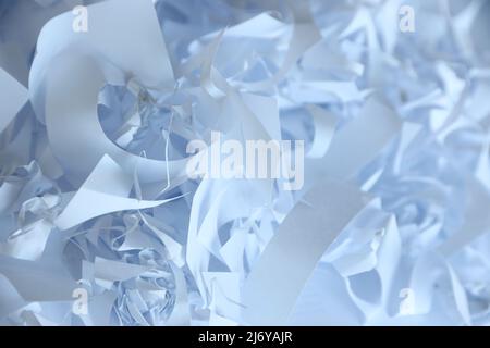 Zerkleinert Papier Textur Hintergrund, Draufsicht auf viele weiße Papierstreifen. Stapel von geschnittenen Papier wie Konfetti für Party oder Box Füllstoff für den Versand zerbrechlich i Stockfoto