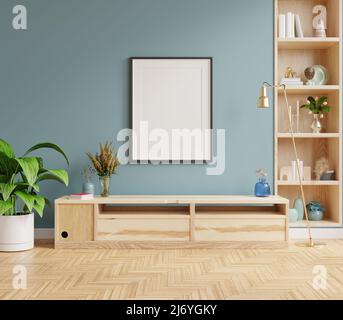 Mock up Poster Rahmen auf Schrank im Inneren und blaue Wand.3D Rendering Stockfoto