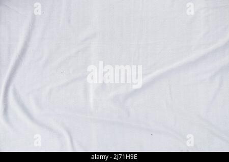 Textur aus weißem Stoff Stoff Stoff Stoff Hintergrund. Draufsicht. Flach legen. Platz für Textur Stockfoto