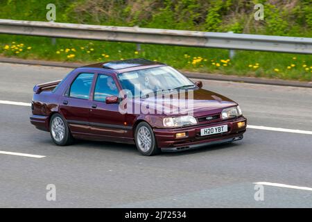 1990 90s Neunziger Ford Sierra SAPPHIRE COSWORTH 4x4 Diesel 5-Gang Schaltgetriebe 1993cc; Fahren auf der Autobahn M61 Großbritannien Stockfoto