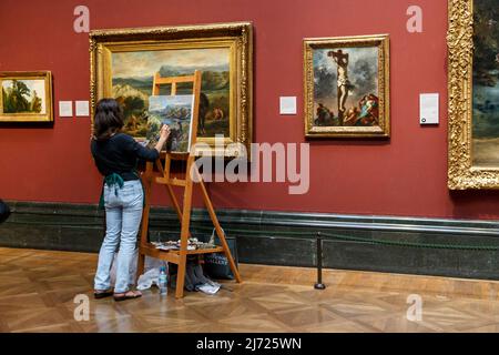 LONDON, GROSSBRITANNIEN - 19. SEPTEMBER 2014: Der Künstler macht eine Kopie eines der Gemälde in der Halle der National Gallery. Stockfoto