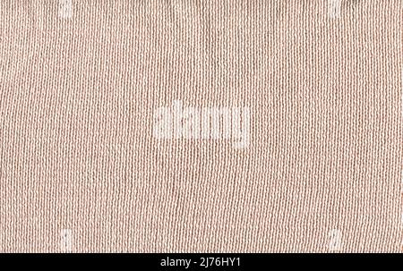 Baumwolle cremefarbenen Stoff gewebte Leinwand für Winter-Design. Wollbeige Frische Pullover dekorativer Hintergrund. Stockfoto