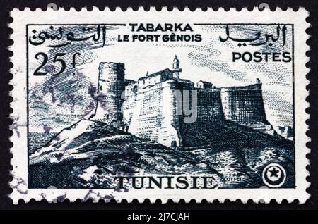 TUNESIEN - UM 1954: Eine in Tunesien gedruckte Briefmarke zeigt das genuesische Fort, Tabarka, um 1954 Stockfoto