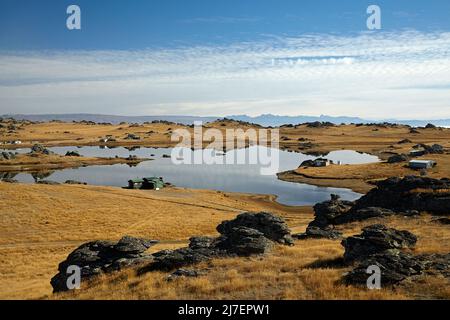 Fischerhütten und Poolburn Dam, Central Otago, Südinsel, Neuseeland Stockfoto