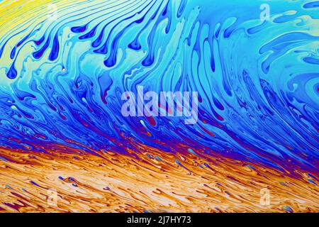 Psychedelischer mehrfarbiger Hintergrund abstrakt. Regenbogen Farben. Muster Hintergrund. Foto-Makro-Aufnahme von Seifenblasen Stockfoto