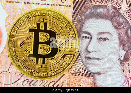 Bitcoin und ein britisches Pfund, Vereinigtes Königreich Stockfoto