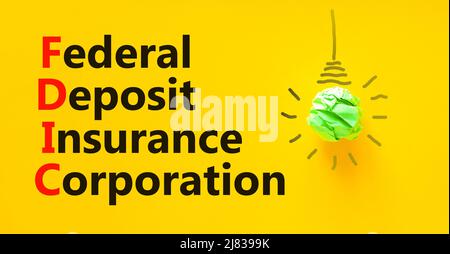 FDIC Bundeseinlagensicherungsgesellschaft Symbol. Konzept Worte FDIC Bundeseinlagensicherung auf gelbem Hintergrund. Business FDIC Federa Stockfoto