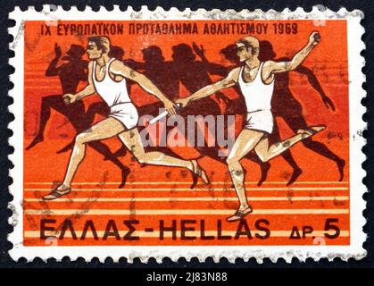 GRIECHENLAND - UM 1969: Eine in Griechenland gedruckte Marke zeigt Staffellauf und Läufer aus Amphora, 525 v. Chr., 9. European Athletic Championships, Athen, c Stockfoto